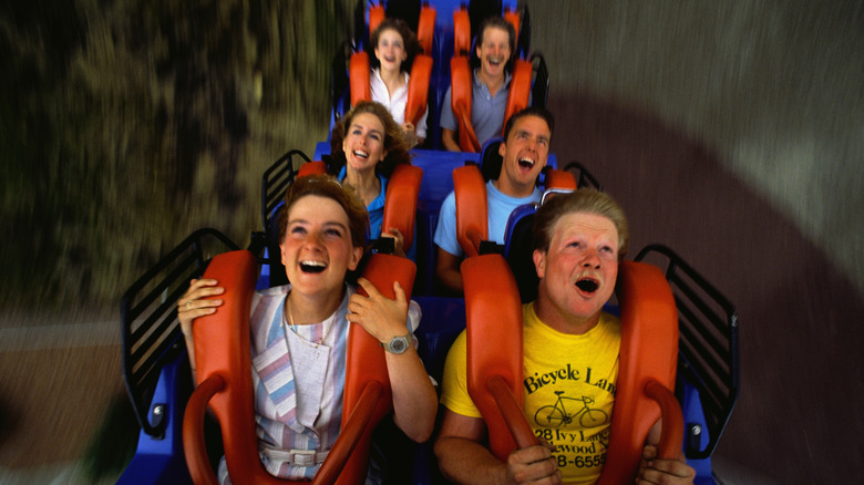 people on a roller coaster in action