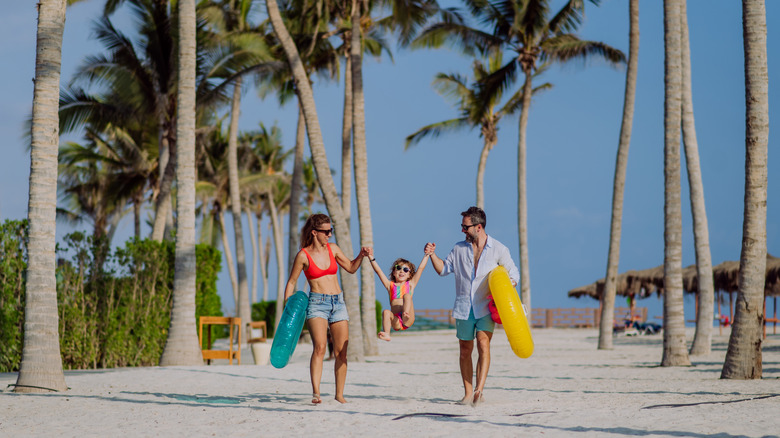 Family on the beach in the Caribbean