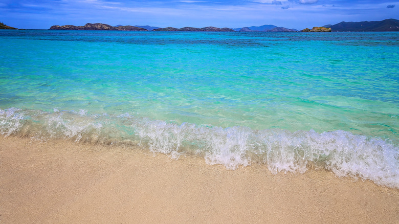 blue waves on white sand