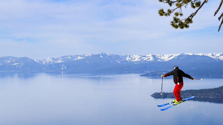 A skier flying into view above Lake Tahoe on the California-Nevada border.