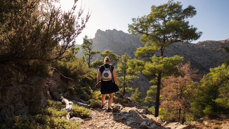 A hiker walks through Halari Gorge on Ikaria Island.