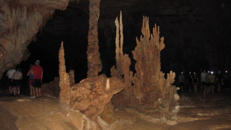 Visitors exploring the cave's chamber