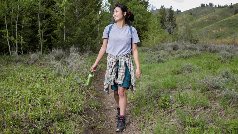Woman hiking in forest