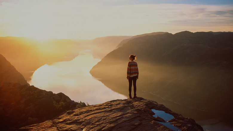 Woman gazing over river