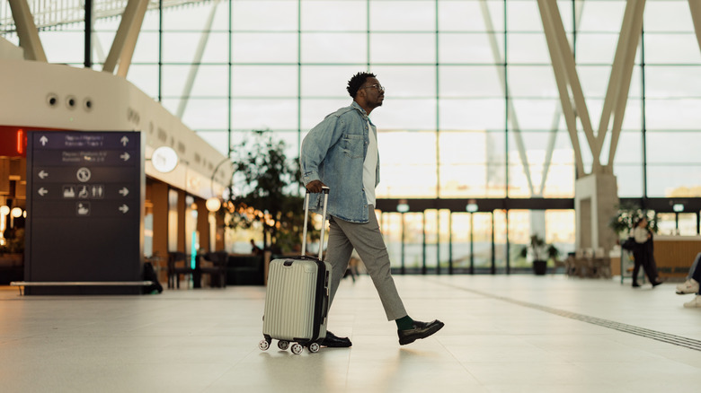 Man walking through an airport