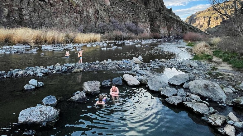People soak in and enjoy Snively Hot Springs in eastern Oregon