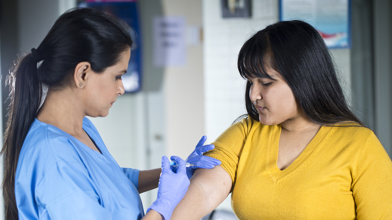 woman getting vaccine