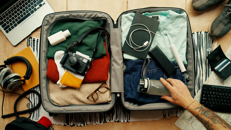 Hand packing luggage