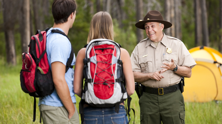 ranger talking to hikers