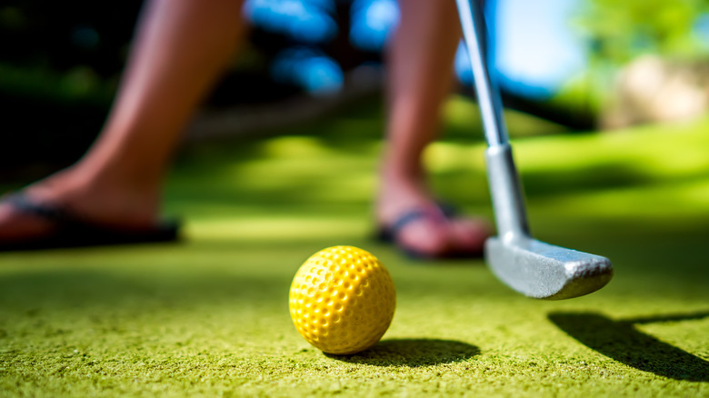 Person playing mini golf