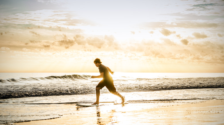 Boy running on a beach