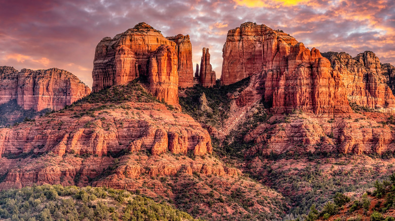 The massive red rocks at Cathedral Rock in Sedona, Arizona, at sunset.