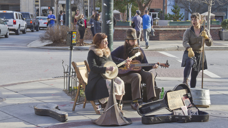 Musicians play on a street corner in Asheville, NC.