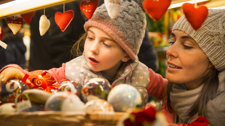 Mother and daughter browsing Christmas ornaments