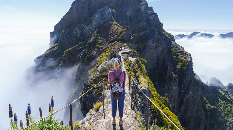 Female hiker at top of peak