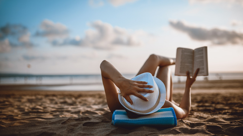 Woman reading on a beach