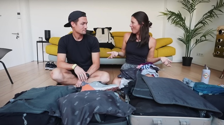 Kara and Nate with open suitcases