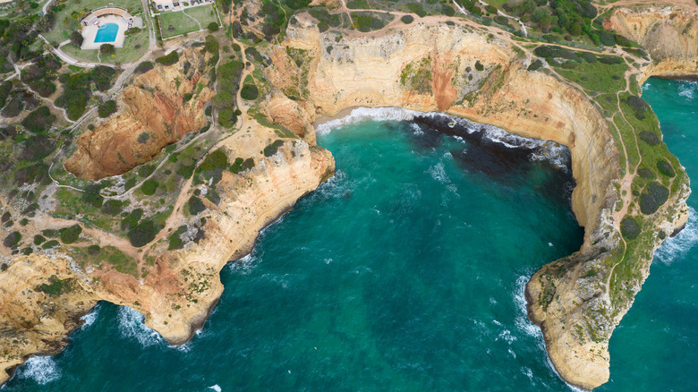 An aerial view of the hiking trails along the coast of Carvoeiro, Portugal