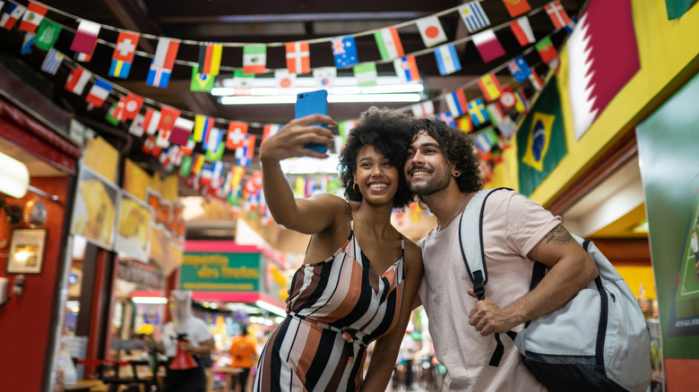 Happy tourists taking photos