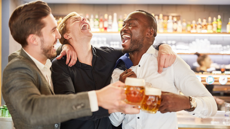 Men drinking at bar 