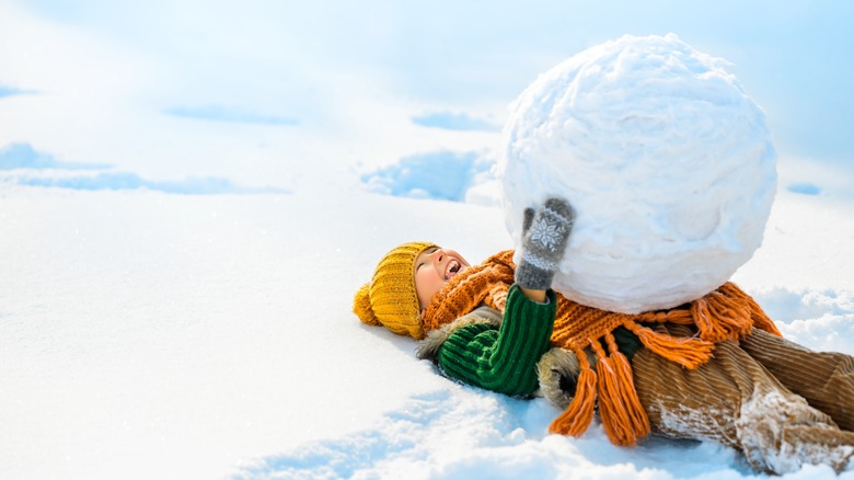 boy with big globe of ice