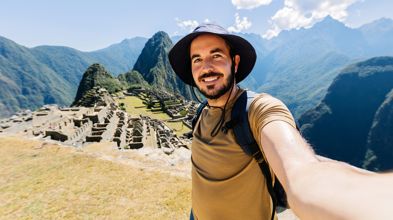 Traveler taking a selfie in Machu Picchu