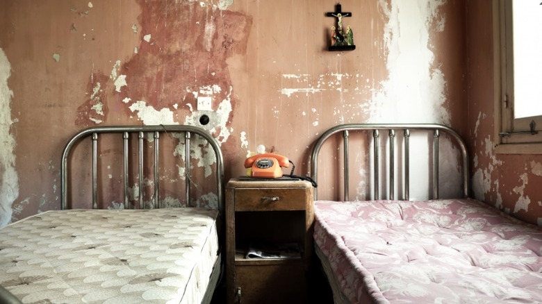 hotel beds in old room