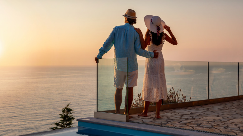 Couple watching sunset from terrace