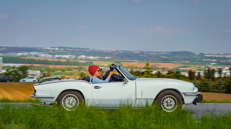 A couple driving a car in Germany.