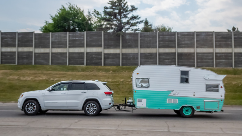 SUV towing a Shasta Airflyte