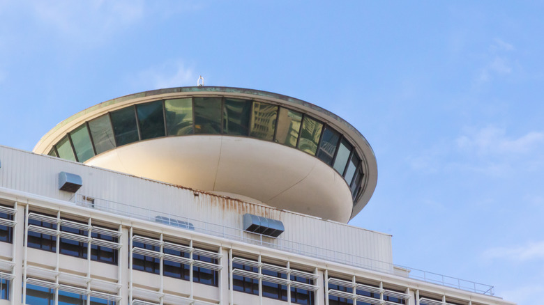 A former revolving restaurant is seen abandoned and rusting
