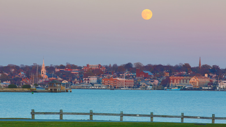 The moon at dusk over a view of Newport, Rhode Island