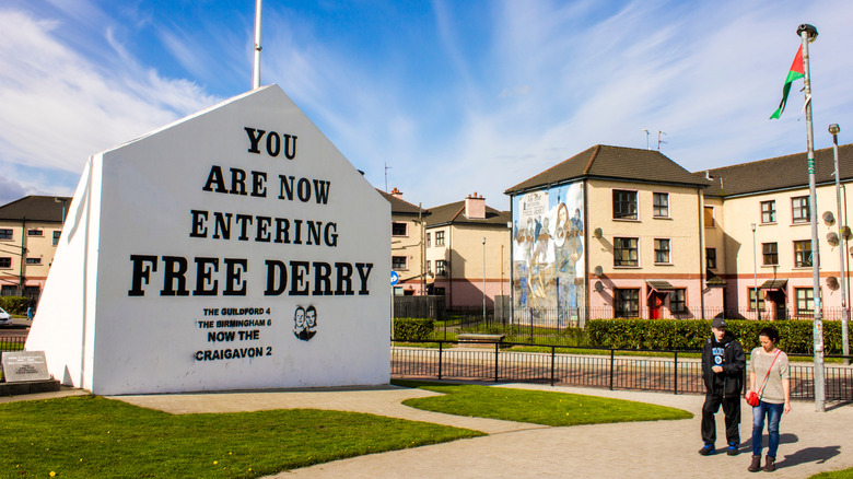 A mural of the cast of the TV show, "Derry Girls" graces the side of a building in Londonderry-Derry, Northern Ireland