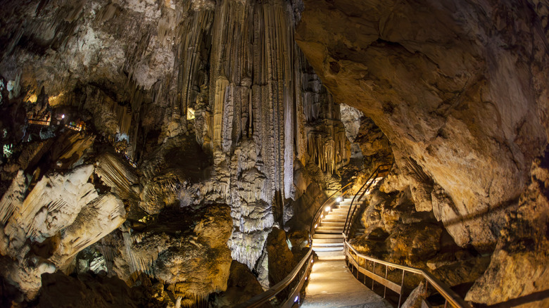 A staircase leading through a large multi-chambered cavern in the Caves of Nerja
