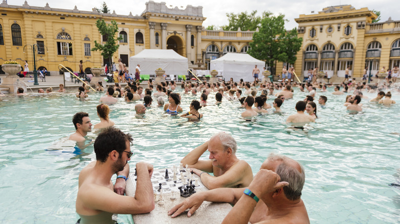 Visitors playing chess inside Szechenyi Baths