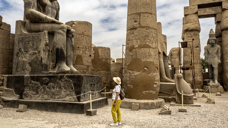 ancient Egyptian statues, columns, sky, clouds