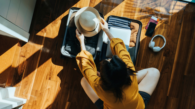 Person packing for vacation