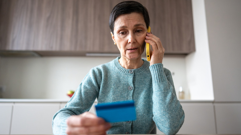Woman on phone with credit card company