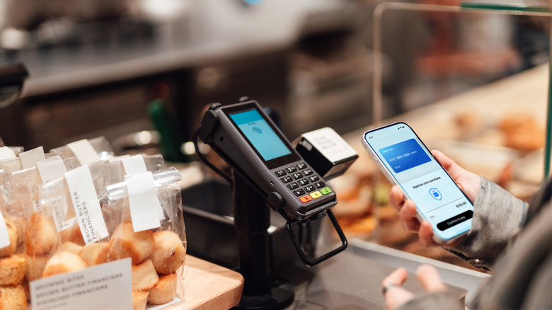 Woman using mobile payment app