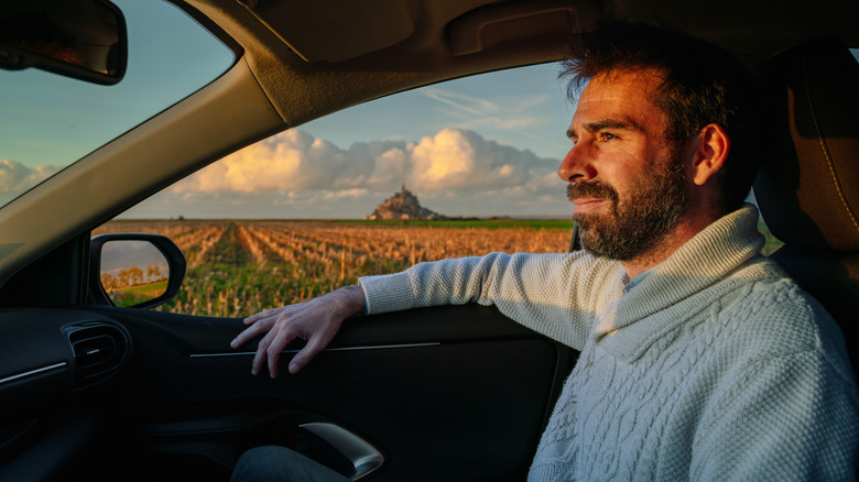 Car passenger in scenic location