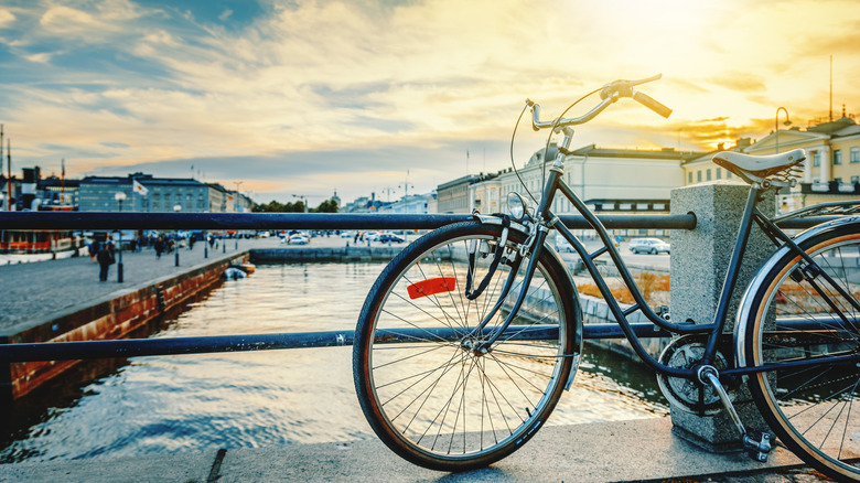 Bike propped against a rail overlooking the harbor of Helsinki