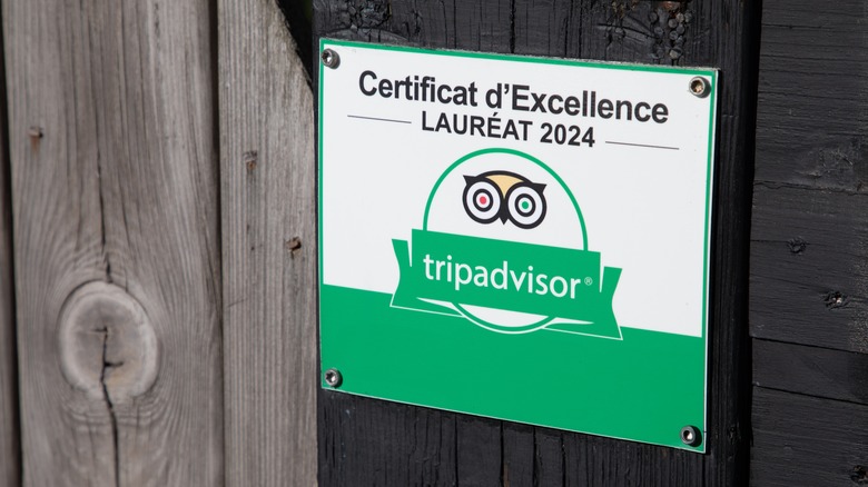 Tripadvisor certificate of excellence on the front of a restaurant