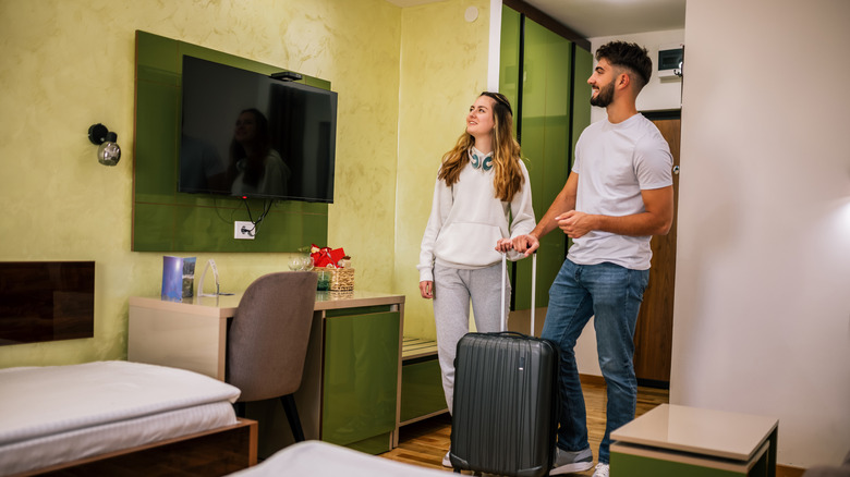 tourists checking hotel room