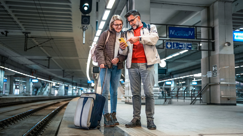 travelers in train station