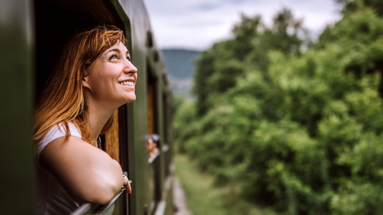 Young woman enjoying train journey