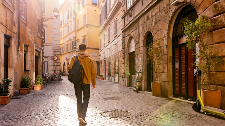 Young man exploring city streets
