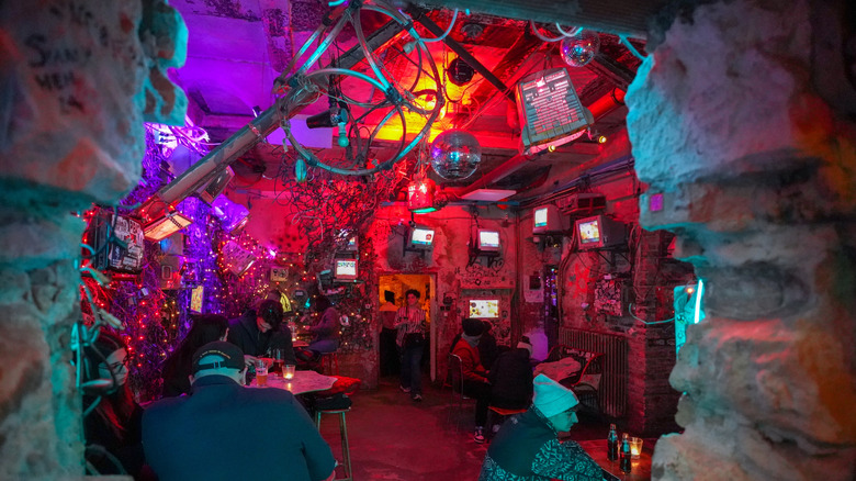 Strange decor and neon lights inside a Budapest ruin pub