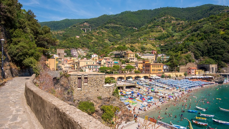 Old Italian village with crowded beach