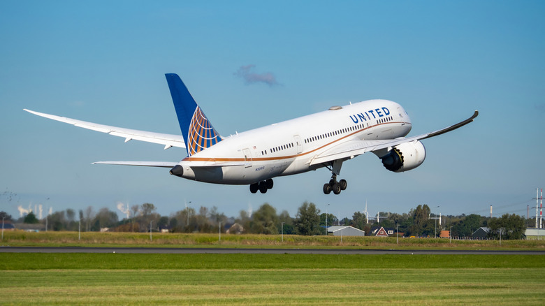 Large commercial aircraft taking off