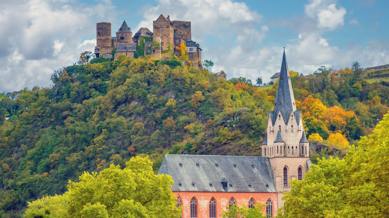 Oberwesel Castle and church appearing out of green trees